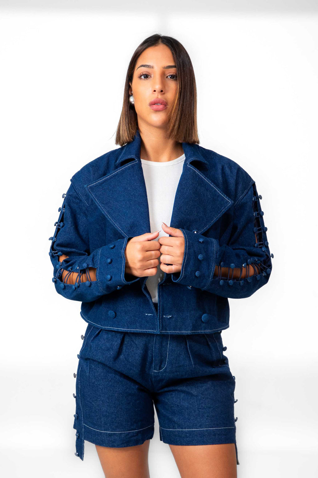 Woman wearing a blue outfit with white background Clep