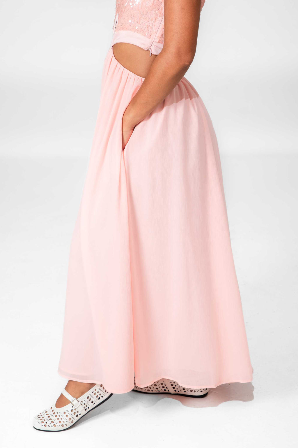 Pink dress with lace details on a white background Clep