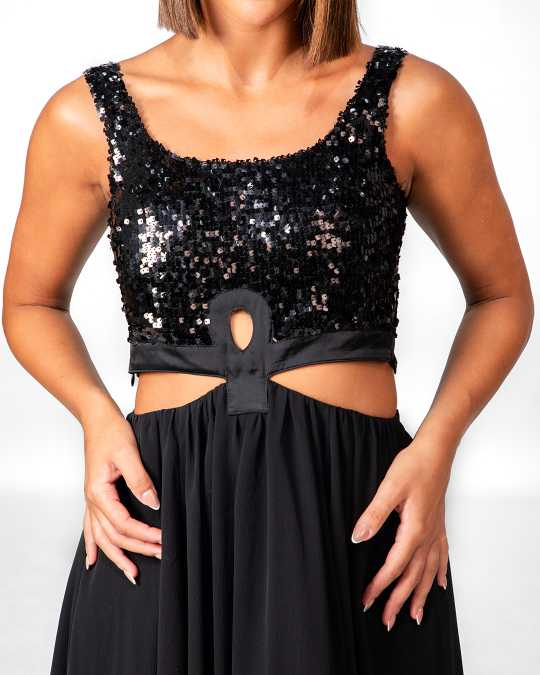 Black sequin top with cutout design worn by a person on a white background Clep
